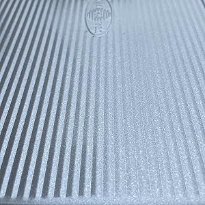 Corrugated texture for nonstick properties, heat distribution, increased air flow